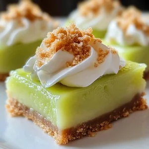 Delicious Key Lime Pie Bars topped with whipped cream and lime zest.