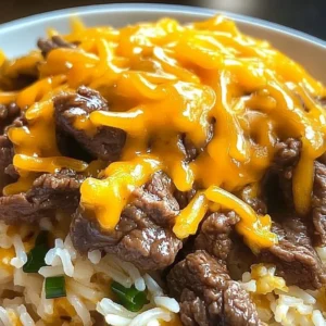 Delicious garlic butter beef served with cheddar rice in a cozy setting