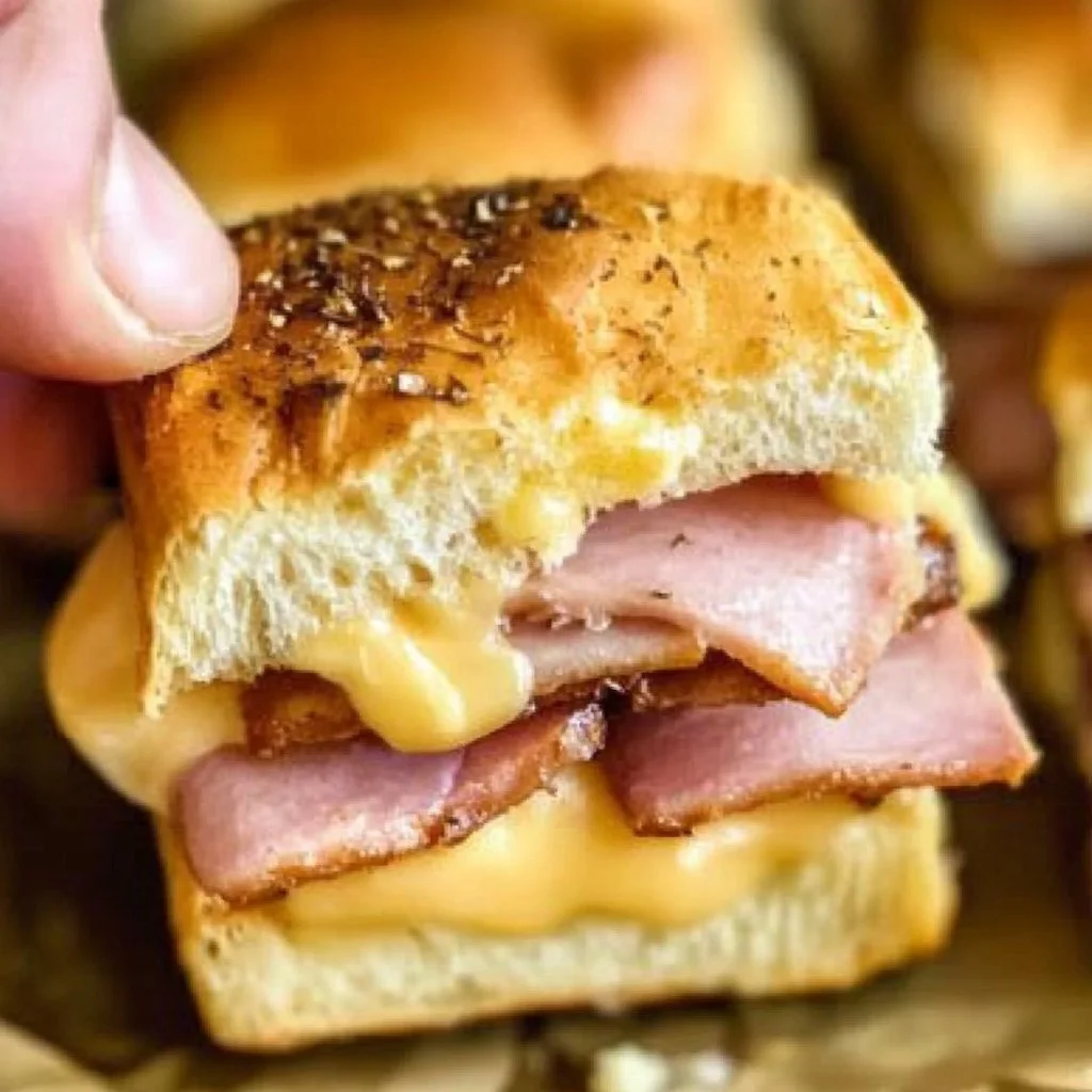 Delicious ham and cheese sliders fresh out of the oven, perfect for any occasion.