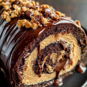Delicious Peanut Butter Cup Chocolate Roll dessert with chocolate and peanut butter layers.