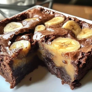 Delicious banana pudding brownies on a plate showcasing sweet layered flavors.