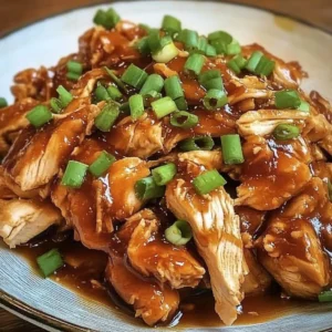 Delicious slow cooker honey sriracha chicken served on a plate