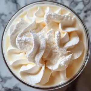 Delicious Chantilly Cream on a dessert plate, showcasing its fluffy texture.