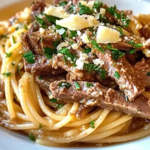 Delicious Garlic Beef Pasta served with herbs and Parmesan cheese
