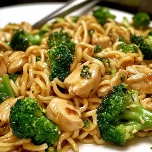 Garlic Chicken Broccoli Noodles served with fresh ingredients on a plate