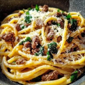 Garlic Parmesan Beef Pasta served in a bowl with herbs and cheese garnish