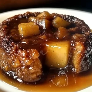 Sticky Apple & Date Butter Pudding with warm sauce and apple slices