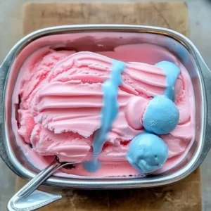 Delicious cotton candy ice cream served in a colorful cone