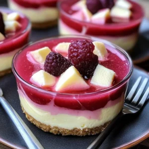 Rhubarb cheesecake creams garnished with fresh rhubarb and whipped cream