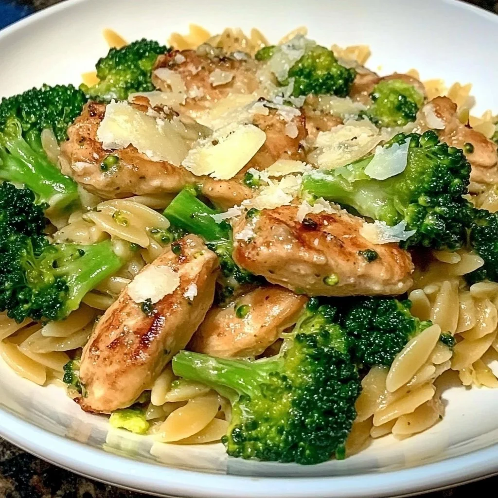 Delicious Chicken Broccoli Orzo garnished with herbs and served in a bowl