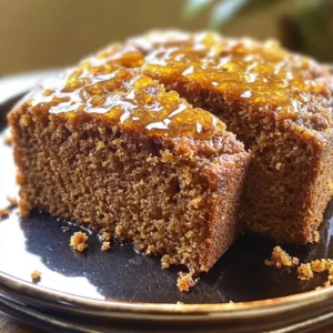 Homemade Ginger Honey Loaf Cake with a golden-brown crust and ginger glaze