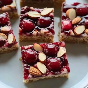 No-bake Almond Cherry Dream Bars with almond and cherry toppings